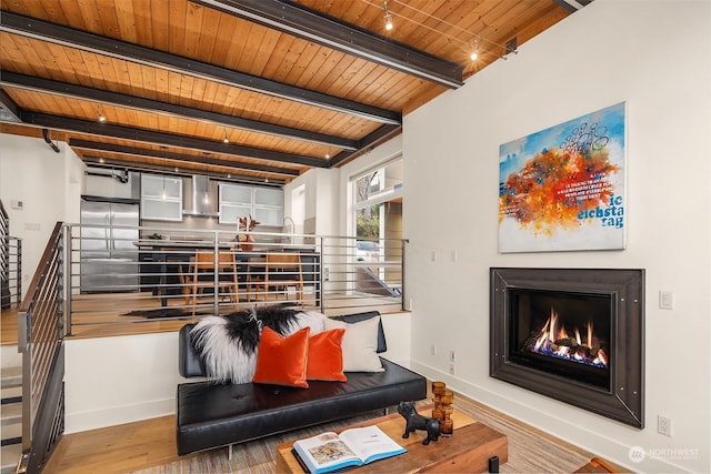 living room featuring hardwood / wood-style floors, beam ceiling, and wood ceiling