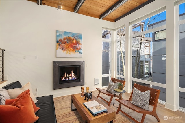 sunroom / solarium with beam ceiling and wood ceiling