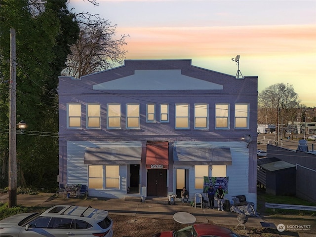 view of back house at dusk