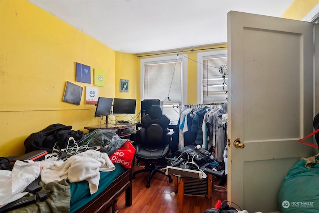 bedroom with hardwood / wood-style flooring