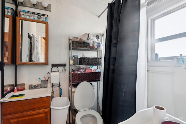 bathroom featuring vanity and toilet