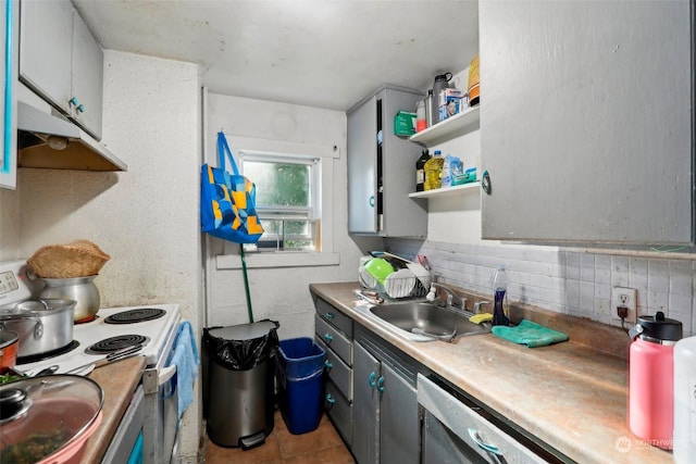 kitchen featuring light tile patterned flooring, sink, gray cabinetry, decorative backsplash, and electric range