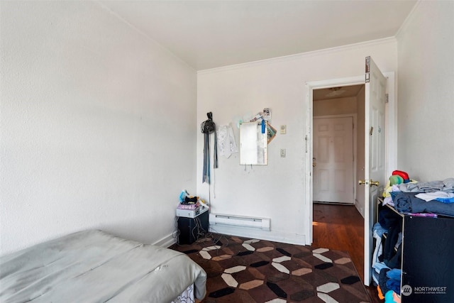 bedroom with crown molding, a baseboard radiator, and dark hardwood / wood-style floors