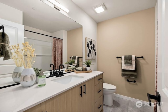 bathroom featuring vanity, toilet, and a shower with shower curtain