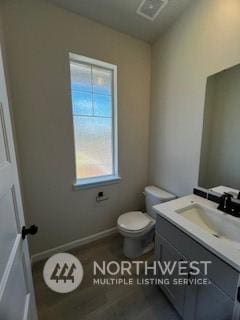 bathroom with vanity and toilet