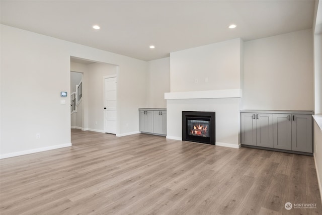 unfurnished living room with light hardwood / wood-style floors