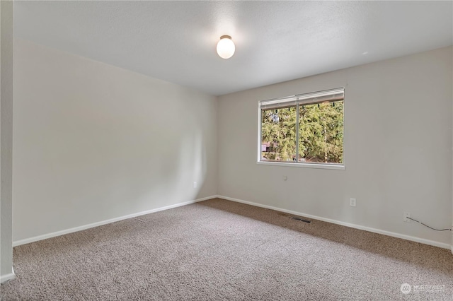 empty room with carpet flooring