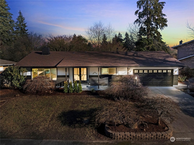 ranch-style home with a garage