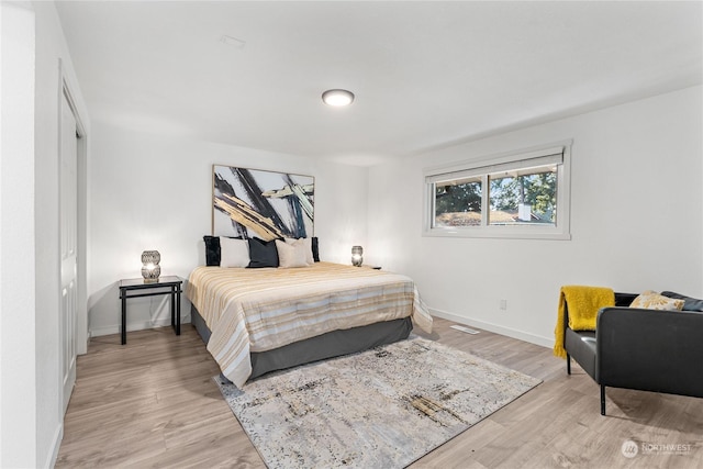 bedroom with light wood-type flooring