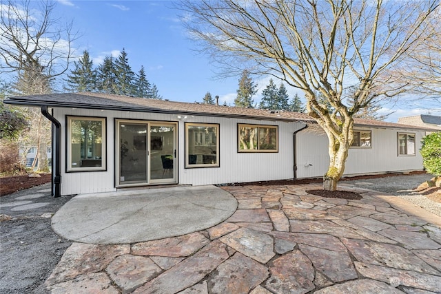 rear view of house with a patio