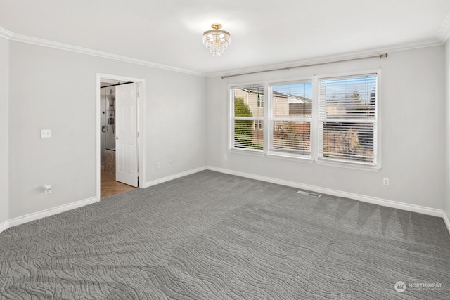 unfurnished room featuring ornamental molding and carpet flooring