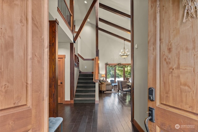 foyer featuring high vaulted ceiling, dark hardwood / wood-style floors, beam ceiling, and a notable chandelier