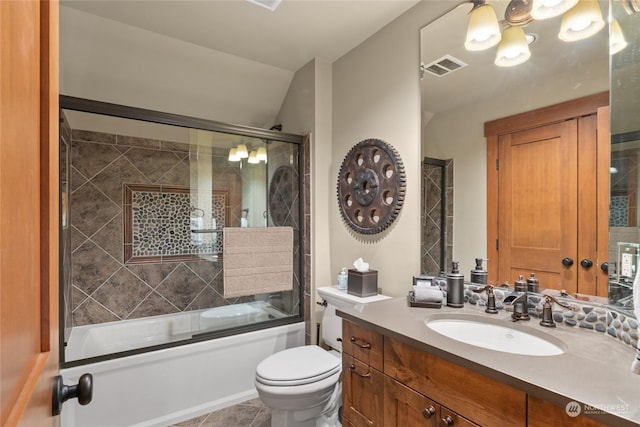 full bathroom with toilet, enclosed tub / shower combo, tile patterned flooring, and vanity