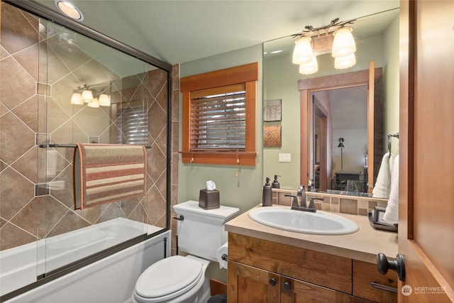 full bathroom featuring toilet, combined bath / shower with glass door, lofted ceiling, and vanity