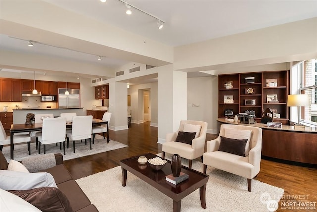 living room featuring dark wood-type flooring