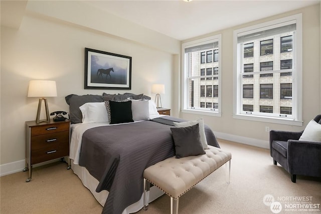 bedroom featuring light carpet