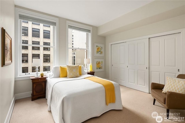 carpeted bedroom featuring a closet