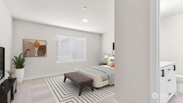 bedroom featuring light colored carpet and baseboards