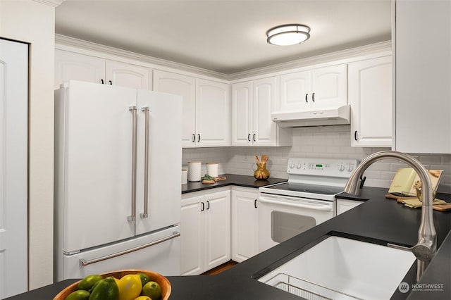 kitchen featuring white cabinetry, sink, white appliances, and tasteful backsplash