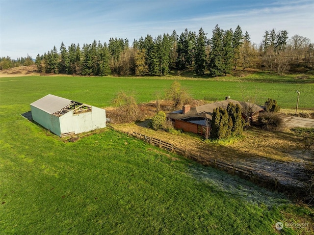 view of storm shelter with a rural view and a lawn