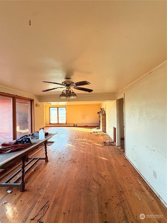 misc room with hardwood / wood-style flooring and ceiling fan