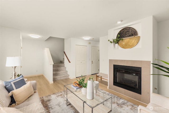 living room featuring a fireplace and light hardwood / wood-style flooring