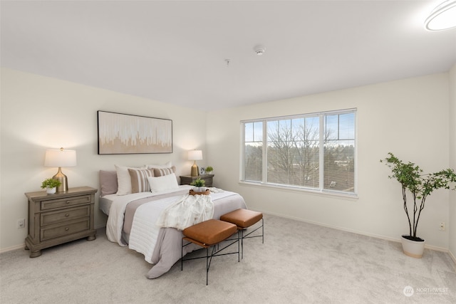 bedroom featuring light colored carpet