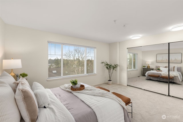 bedroom featuring light carpet