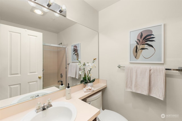 full bathroom featuring toilet, vanity, and tiled shower / bath