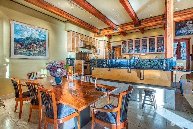 tiled dining area with beam ceiling and bar area