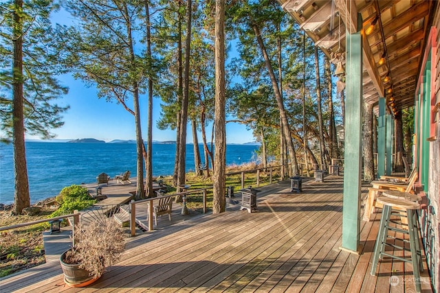 deck featuring a water and mountain view