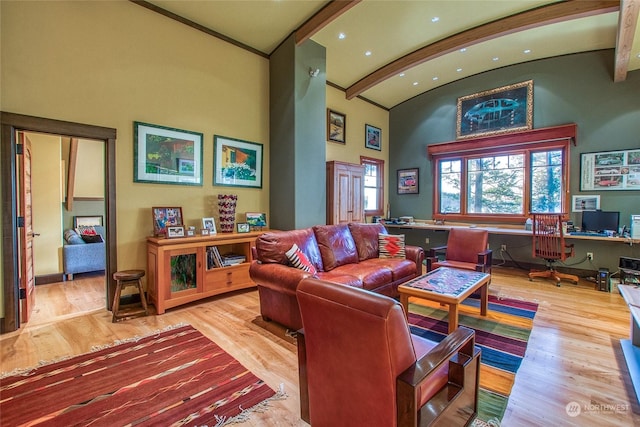 living room with high vaulted ceiling, light hardwood / wood-style floors, and beamed ceiling
