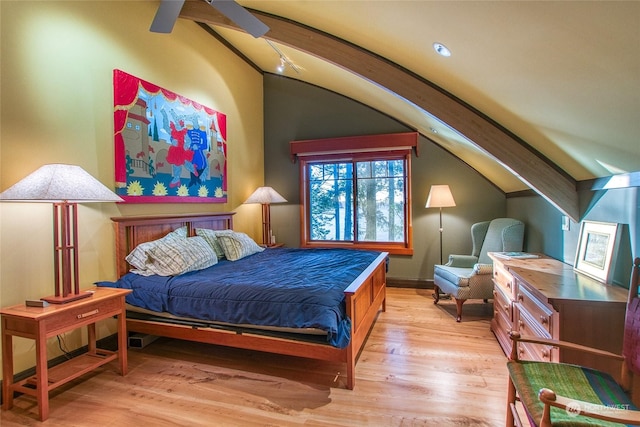 bedroom featuring lofted ceiling and light wood-type flooring