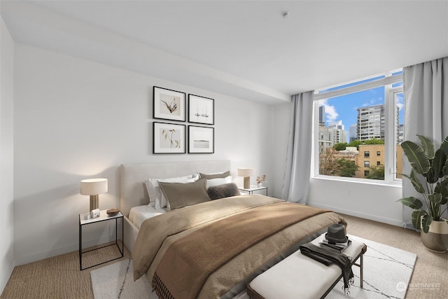 carpeted bedroom featuring multiple windows