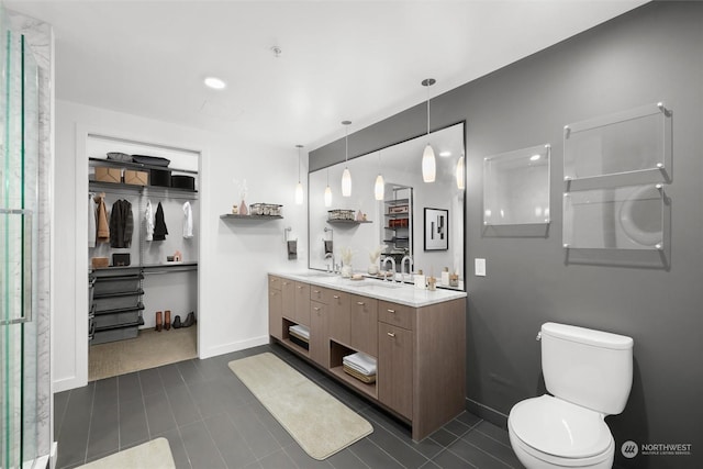 bathroom featuring toilet, tile patterned floors, and vanity