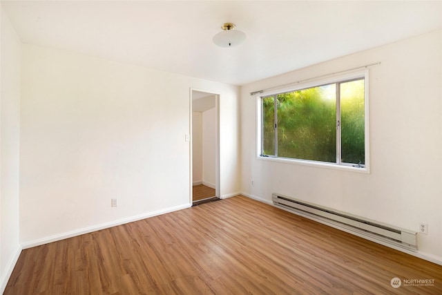 735 Harbor St, Friday Harbor, WA 98250 - unfurnished room featuring hardwood / wood-style flooring and a baseboard radiator