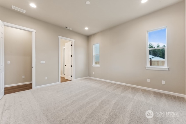 spare room with carpet flooring