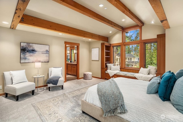 bedroom featuring ensuite bathroom, light carpet, and lofted ceiling with beams