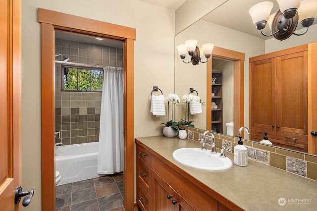 full bathroom with toilet, a chandelier, shower / bath combination with curtain, and vanity