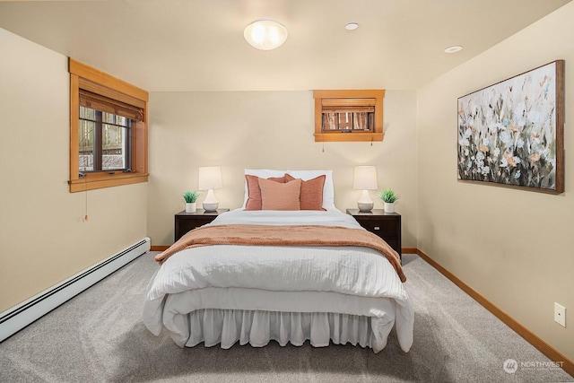 bedroom featuring a baseboard radiator and carpet