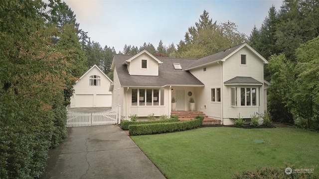 view of front property with a garage and a front yard