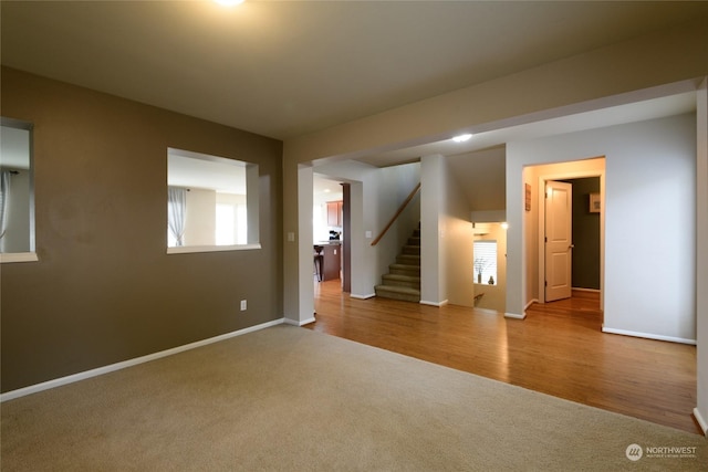 empty room with light colored carpet and a wealth of natural light