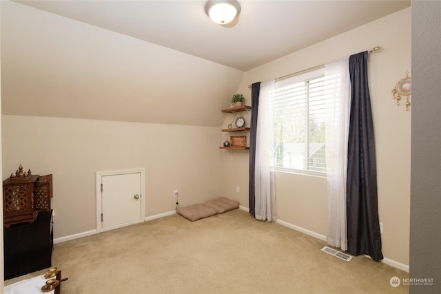 bonus room featuring light carpet and lofted ceiling