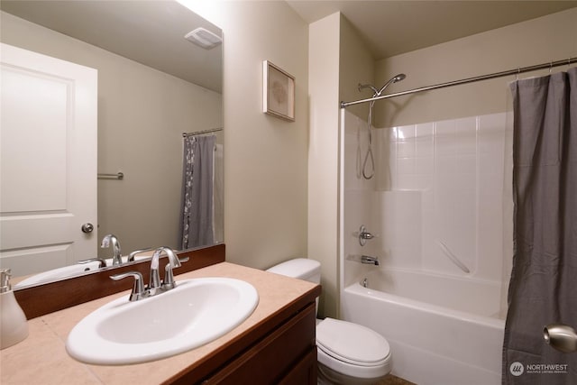 full bathroom featuring vanity, toilet, and shower / bath combo with shower curtain