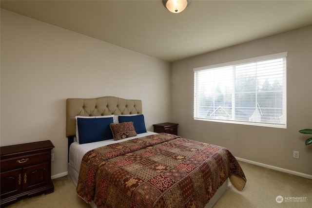 bedroom featuring light carpet