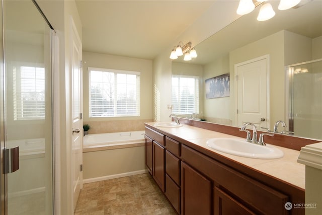 bathroom featuring plus walk in shower and vanity