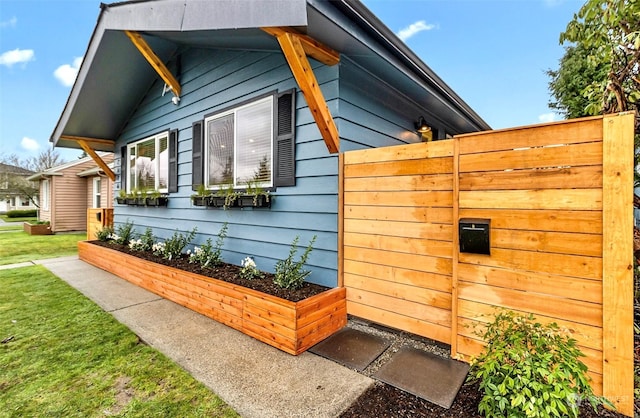 view of home's exterior with a yard