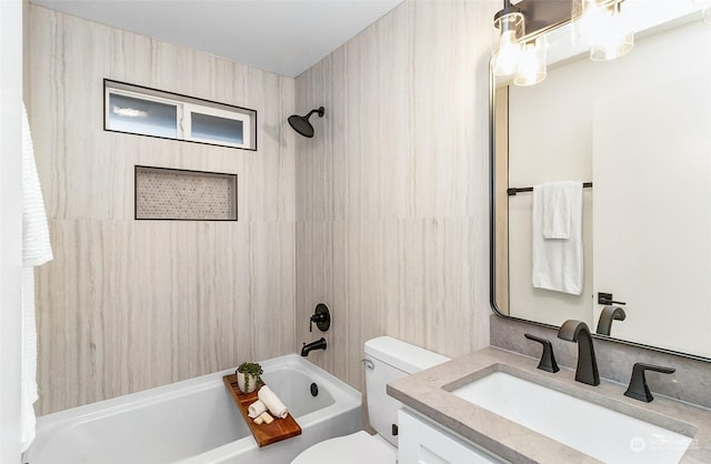 full bathroom with tiled shower / bath combo, vanity, and toilet