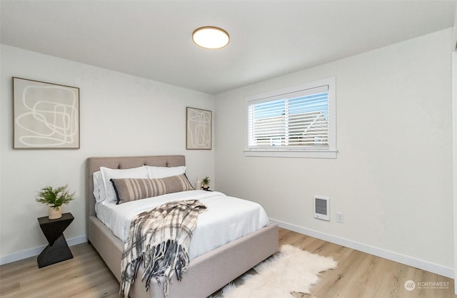 bedroom featuring light hardwood / wood-style floors