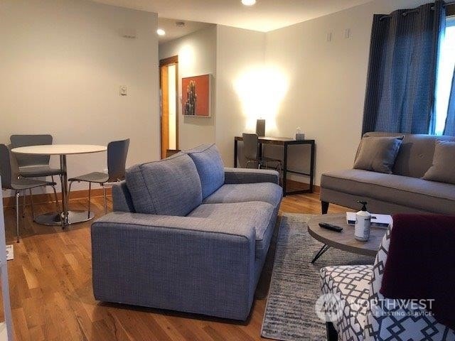 living room with wood-type flooring